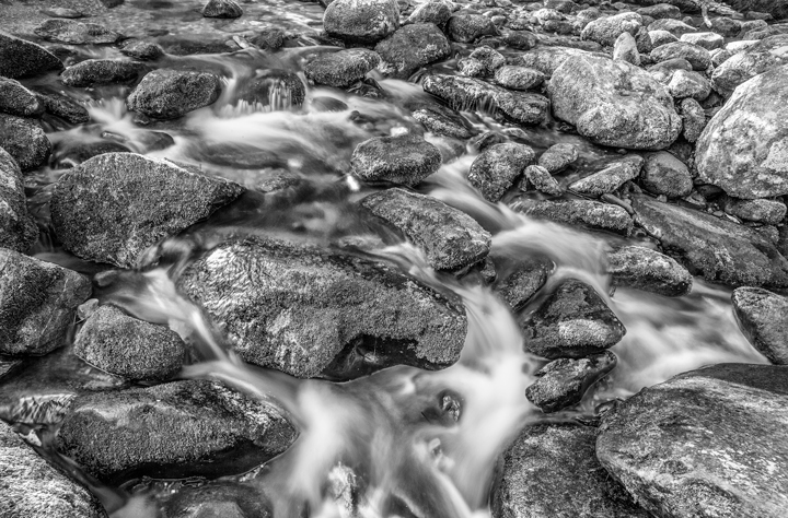 Black and White Photography of a River and Rocks