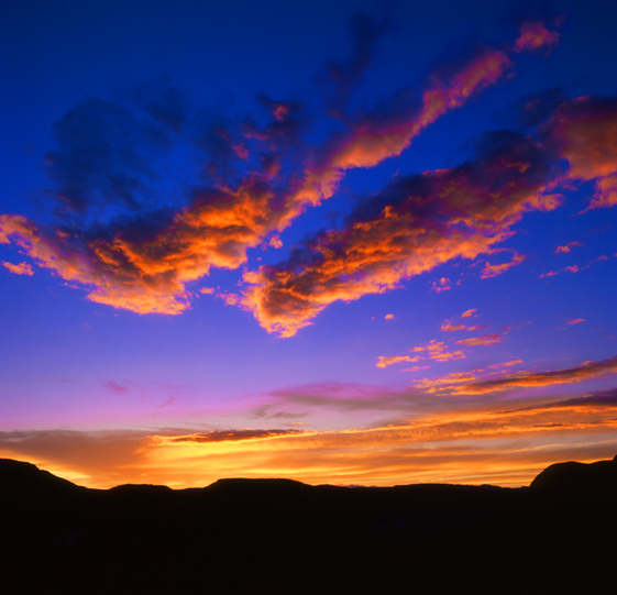 Orange Sunset with Deep Blue Sky Over Southwest Mountains