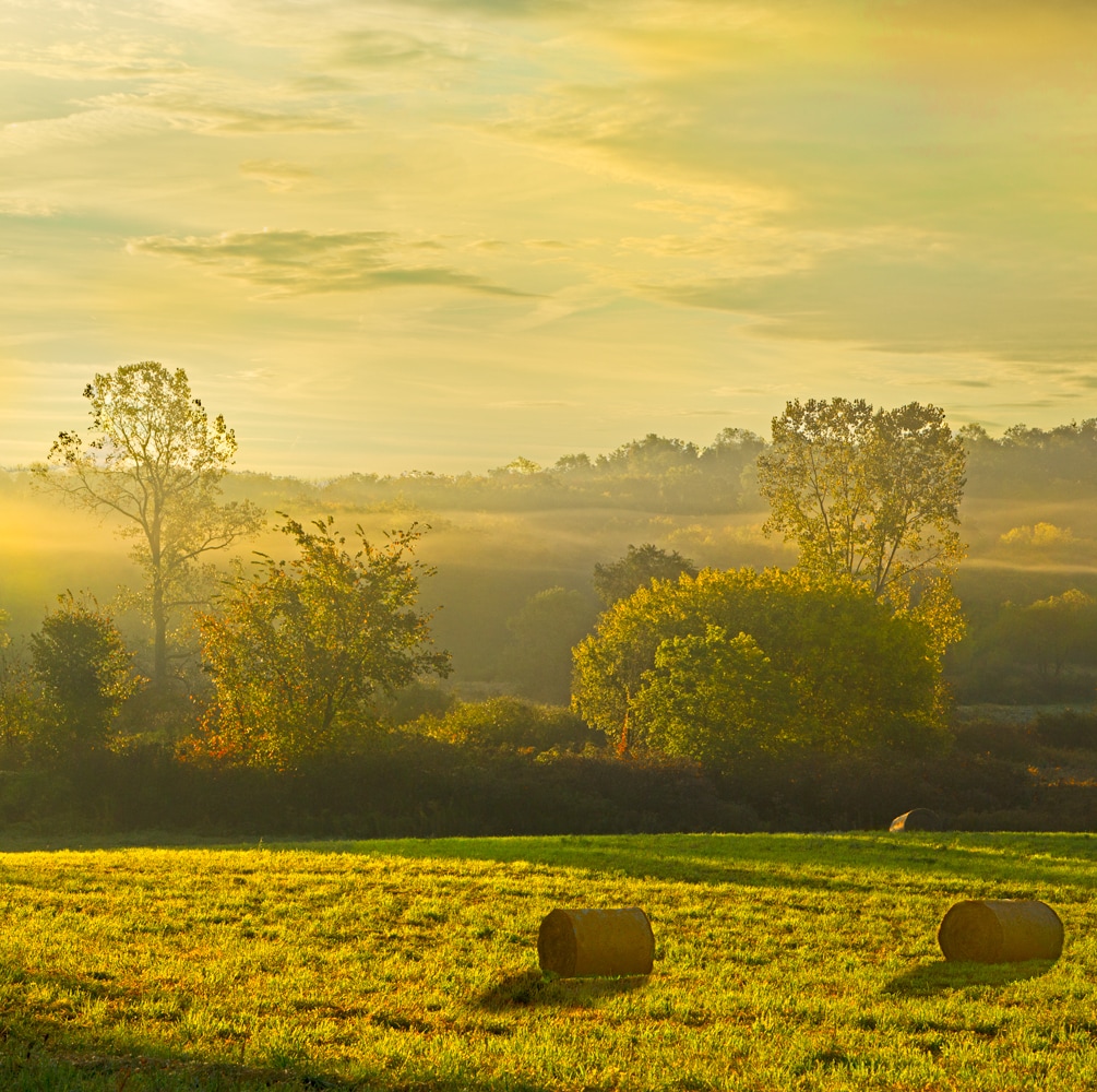 Farmland photography with bales of hay